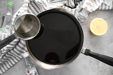 Add lemon juice, water and liquor